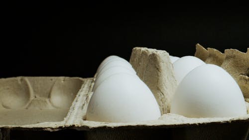 White Eggs on Brown Egg Tray