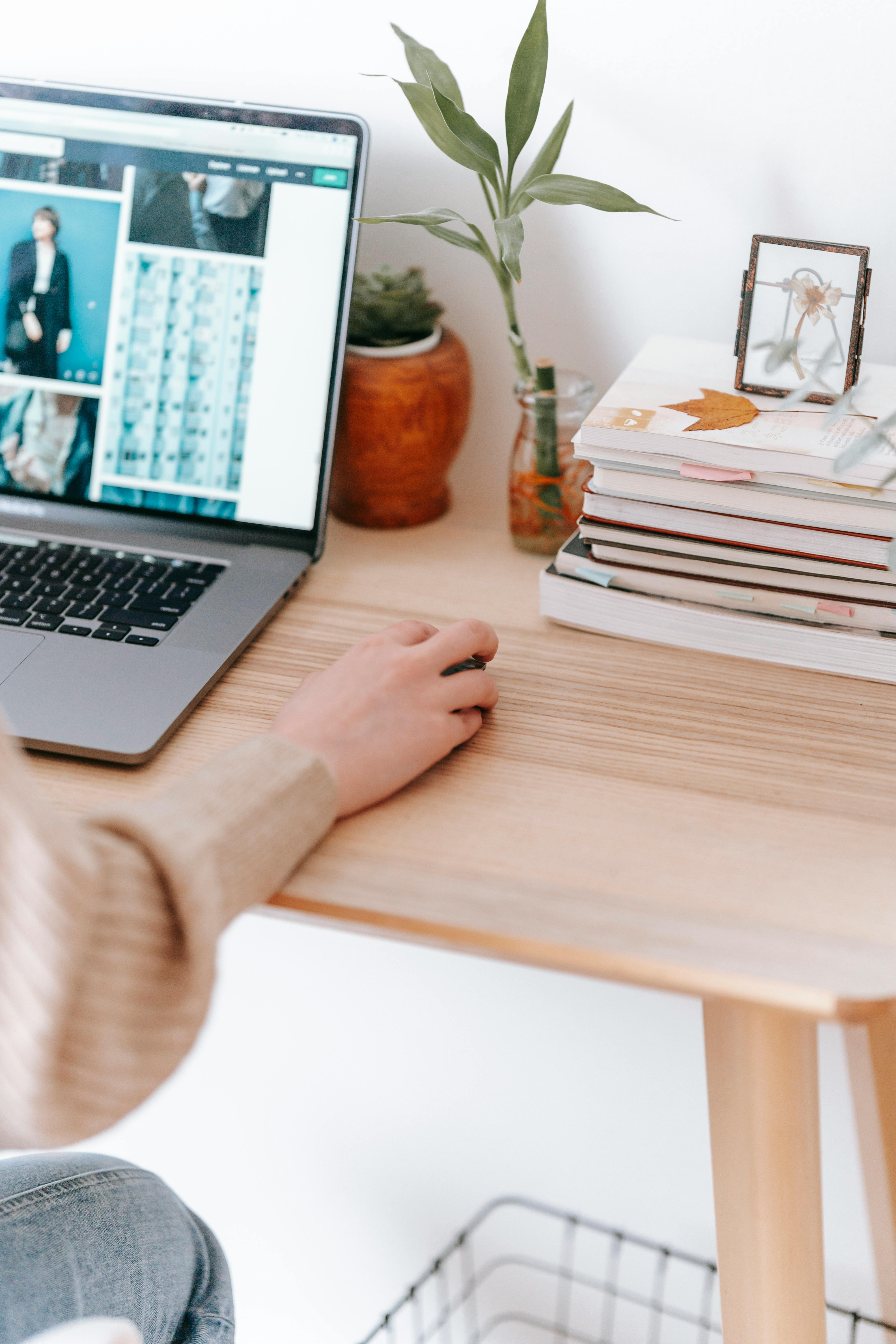 crop freelancer working on laptop at home