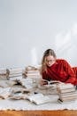 Concentrated woman reading book on floor