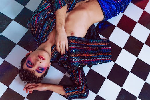 Colorful fashion portrait with bold makeup on a black and white checkered floor.
