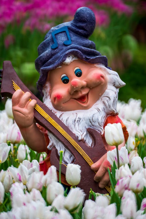 Free A Dwarf Figurine in the Garden Stock Photo