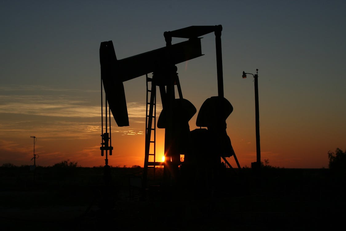 Oil Pump Machine Under Orange Sunset