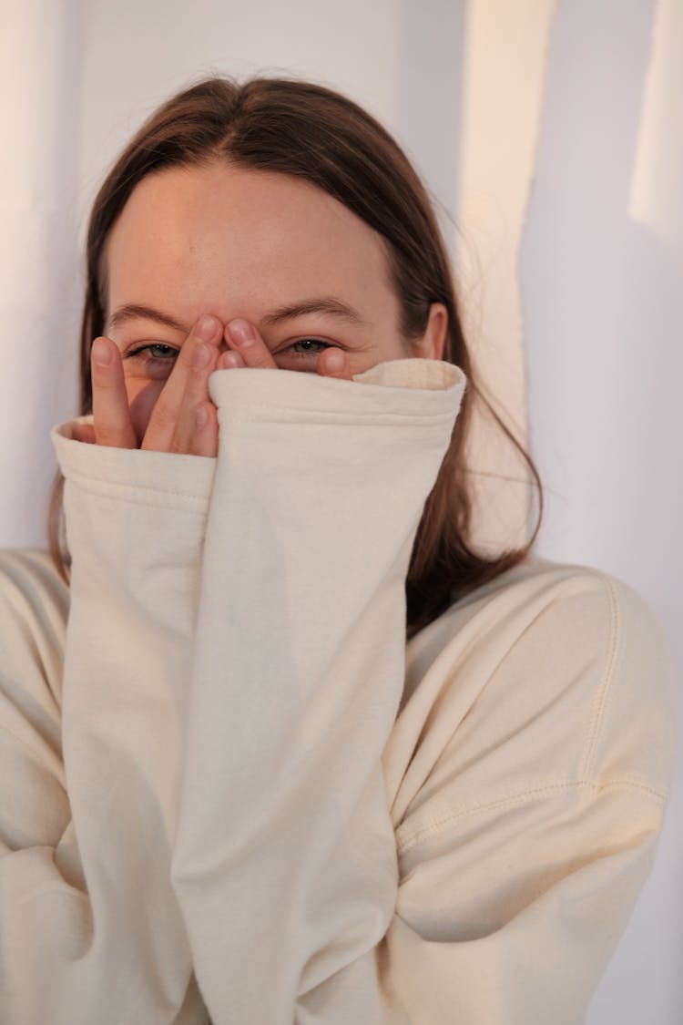 Young Woman Laughing And Covering Face