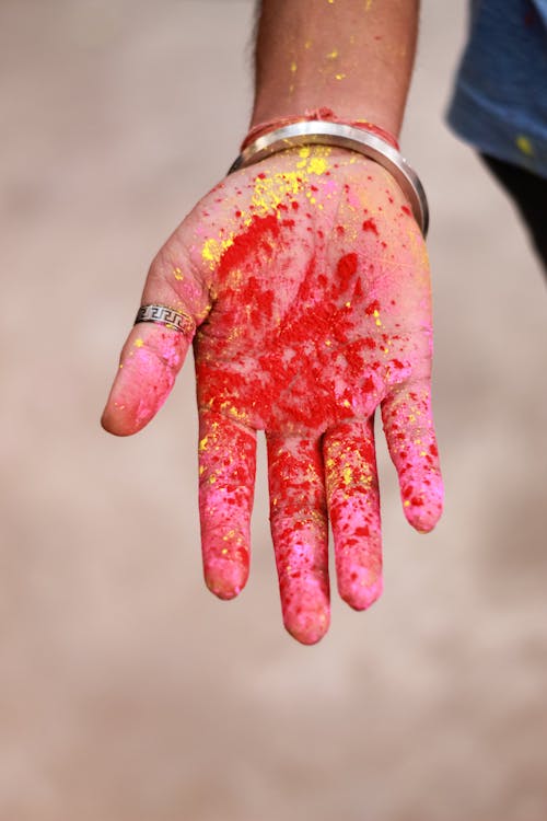 Free Person With Red Paint on Hand Stock Photo