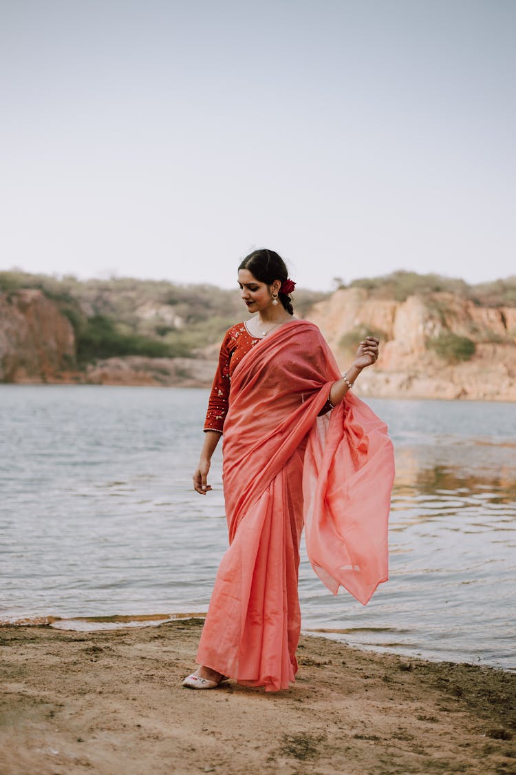 Woman In Traditional Indian Dress On Riverside