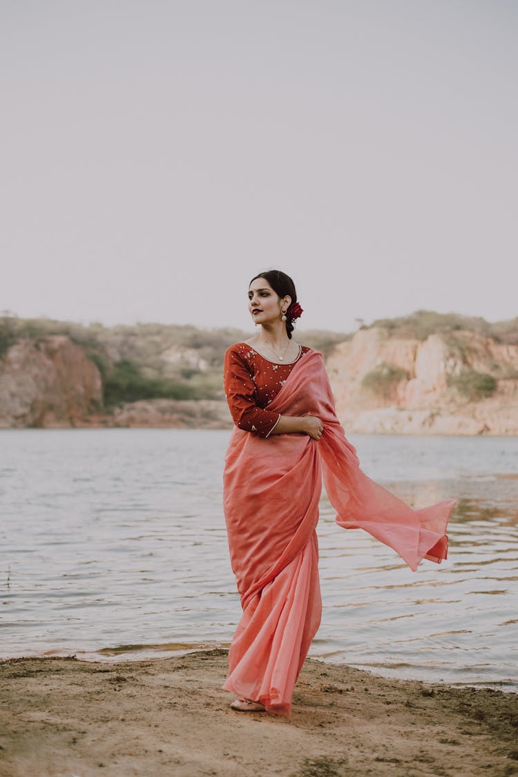 Elegant Ethnic Woman Wearing Silk Sari Standing On River Shore