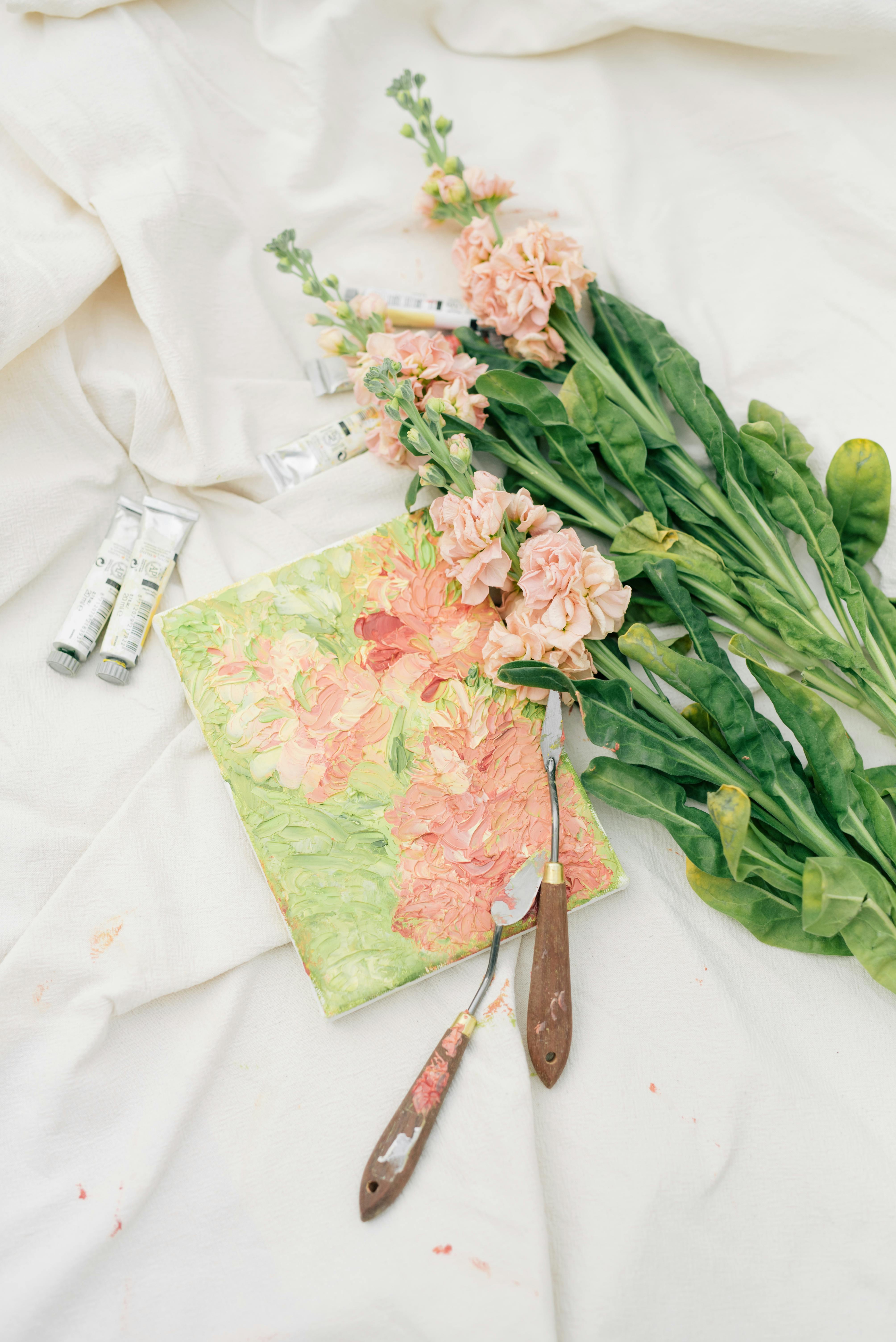 a personalized notebook beside bunch of flowers