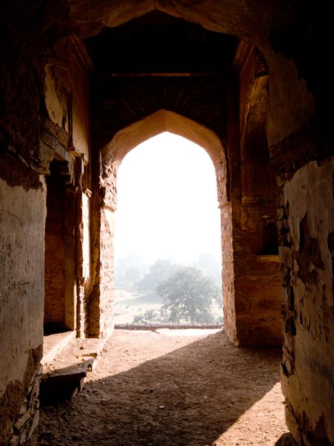 A stunning view through the ancient archways of Rundh Bhangarh, Rajasthan, India.
