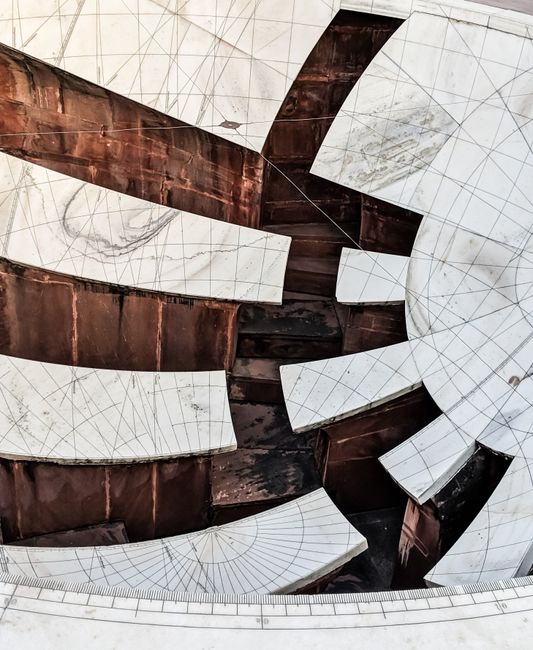 Abstract view of a modern architectural ceiling with geometric shapes and lines.