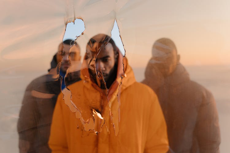 Men Standing Near The Burnt Orange Plastic 