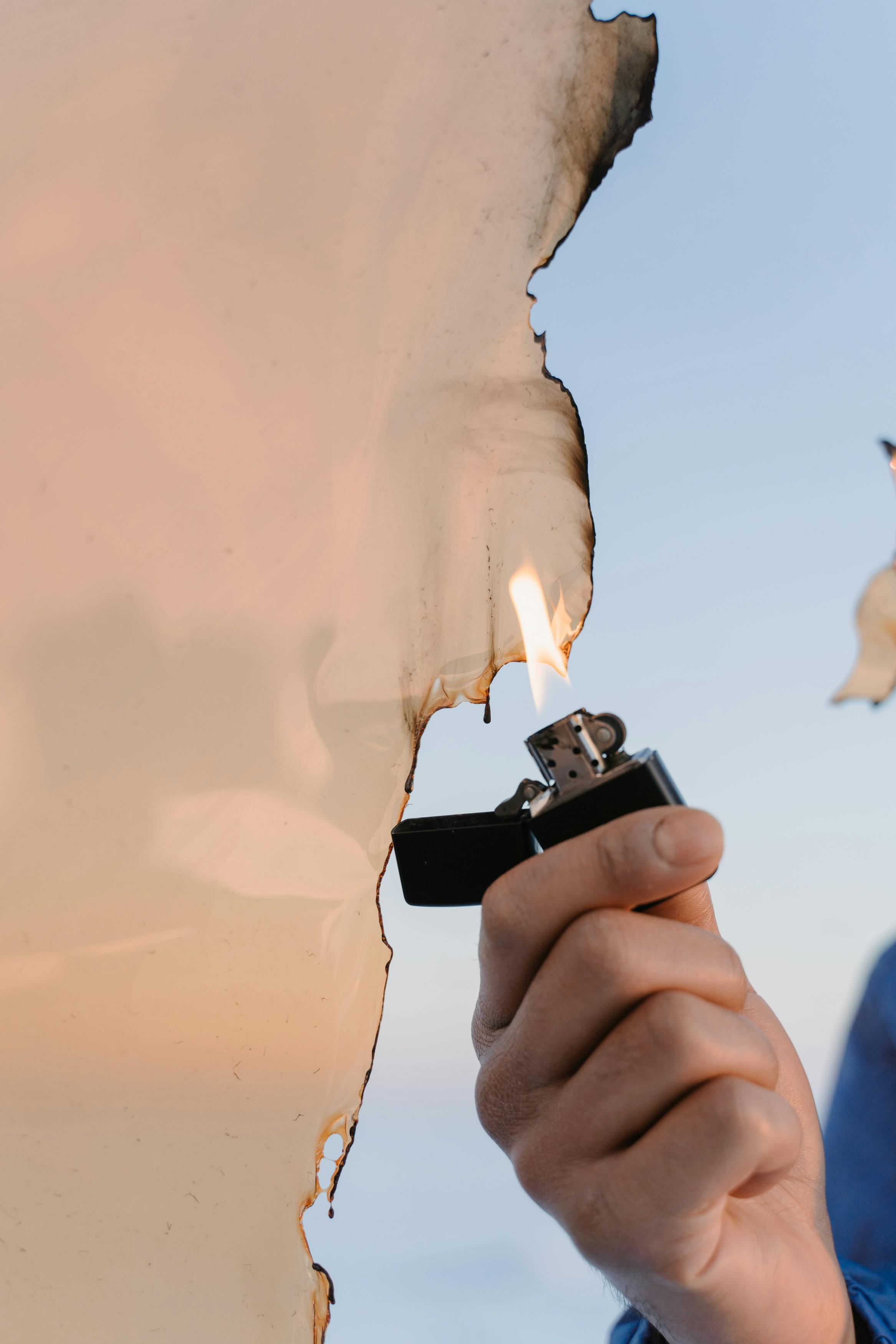 a person burning plastic