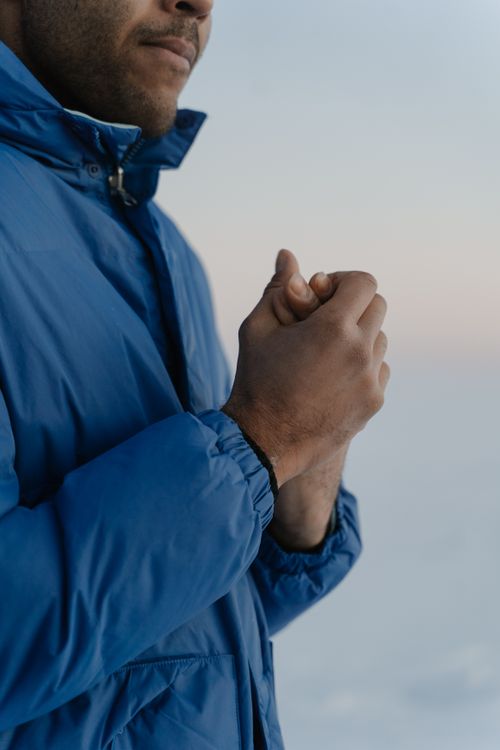 Man in Blue Jacket Holding His Hand Together · Free Stock Photo