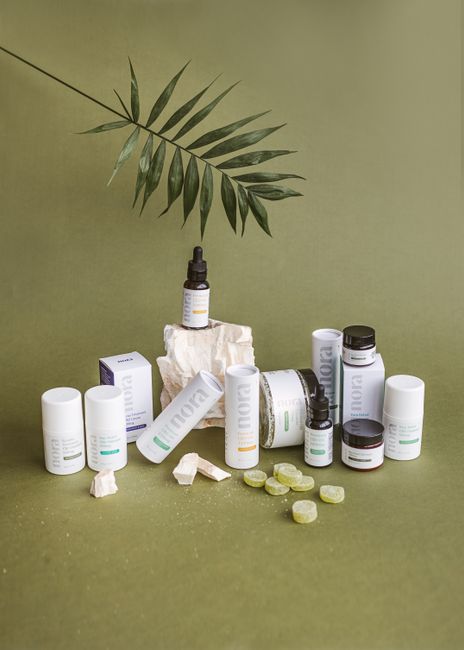 Elegant display of CBD products with a green backdrop, emphasizing natural health products.