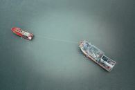 Barge and boat on rippling water