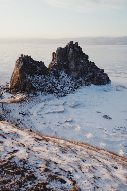 Rocks Formation Above the Frozen Body of Water