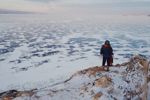 A Person Standing Near the Lake