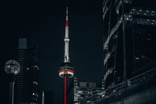 Free Black and Red Tower in the City during Night Time Stock Photo