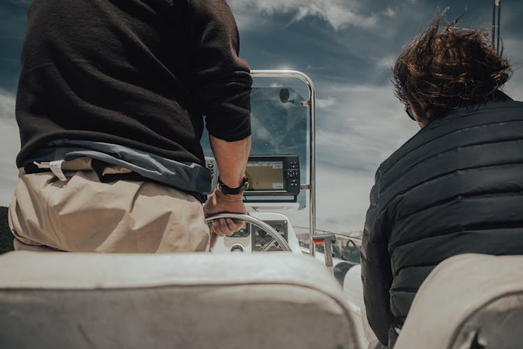 A Man Driving A Speedboat