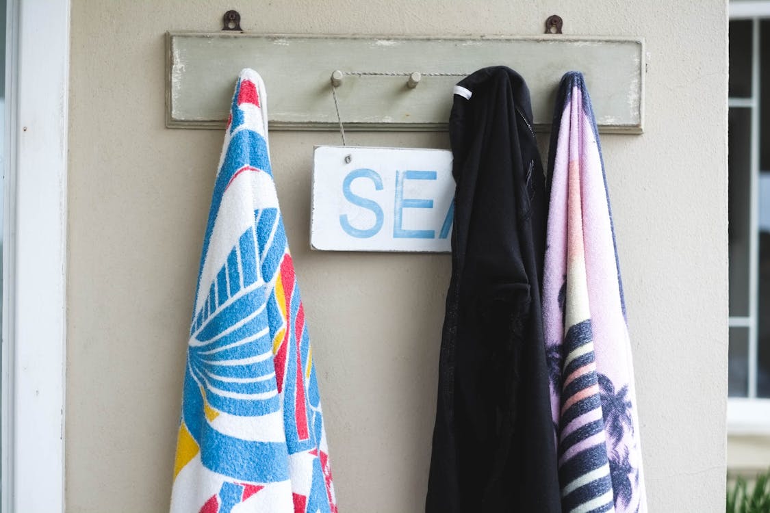 Free stock photo of beach house, seaside, towels on hook Stock Photo