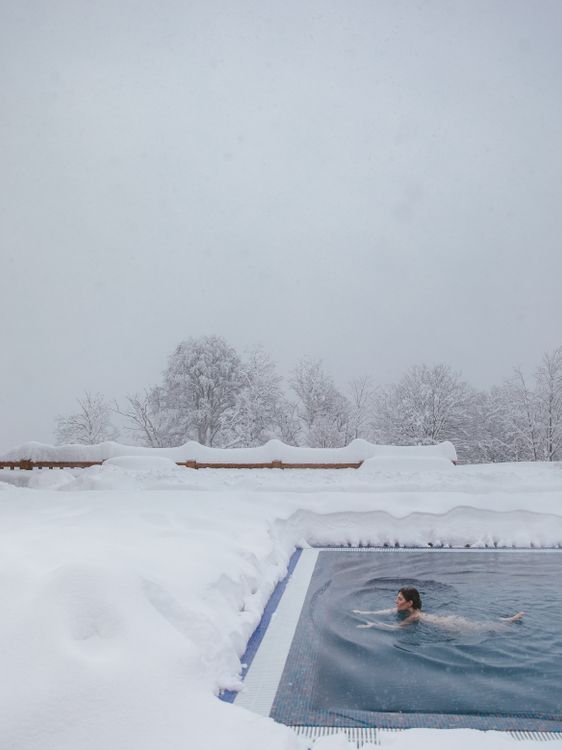 Pool In Snow Photo of a Person Swimming in a Swimming Pool During Winter · Free ...