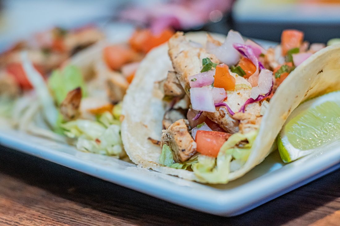 Chicken and lime tacos on a plate. Photo by Styves Exantus on Pexels.