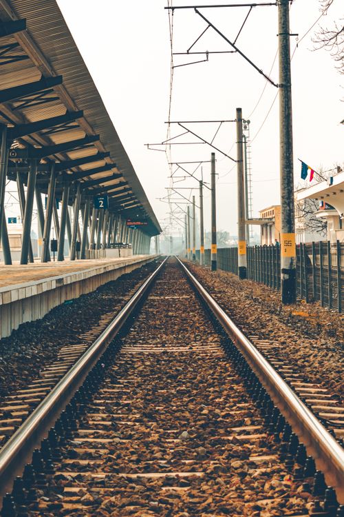 Free Symmetrical view of railway tracks at Sfântu Gheorghe train station in Romania. Stock Photo