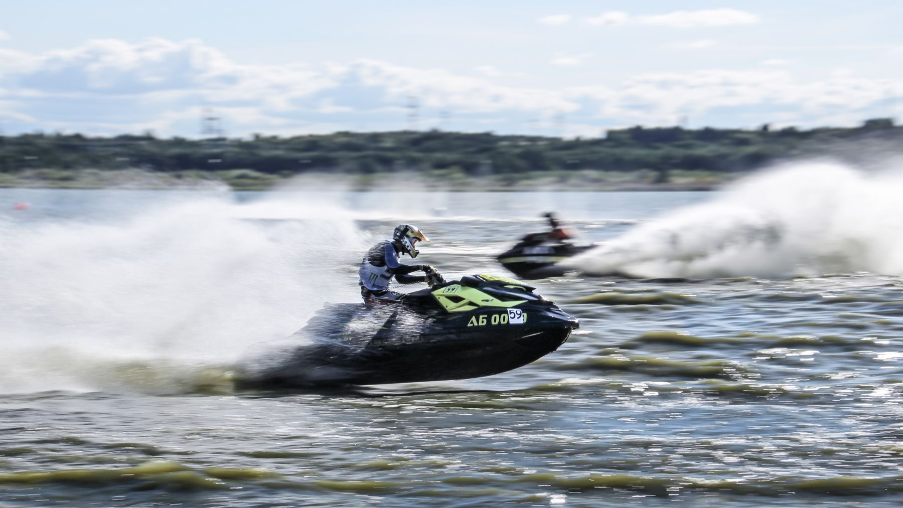 Jet ski rider carving through open water