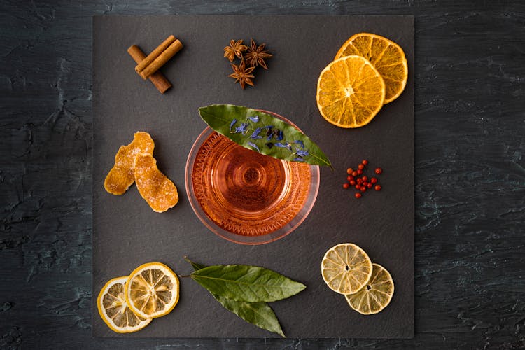 Top View Of A Cocktail In A Glass And Ingredients Scattered Around It 