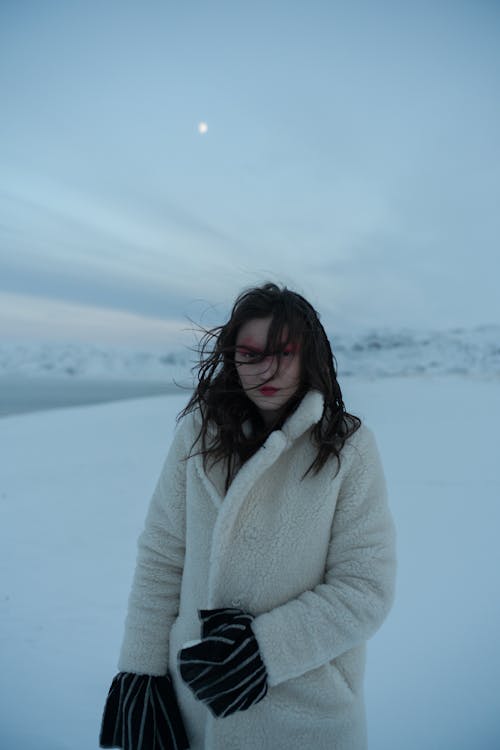 Shallow Focus of a Woman Wearing Winter Coat during Winter