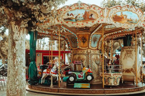 Free Delightful vintage carousel with painted horses and classic design outdoors. Stock Photo