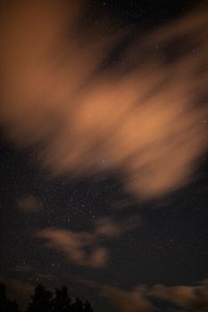 A captivating view of the night sky filled with stars and clouds over Algeria.