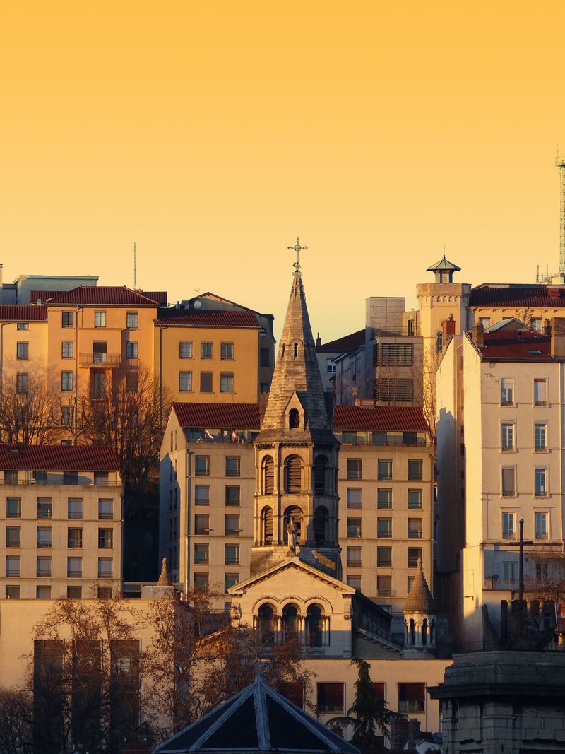 Saint George church spire among the old buildings of Vieux Lyon