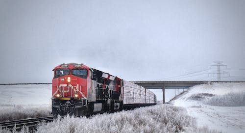 Free Red Train on Snow Covered Ground Stock Photo