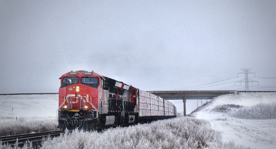 The iconic VIA Rail Canada 'The Canadian' train winding through a scenic Canadian landscape.