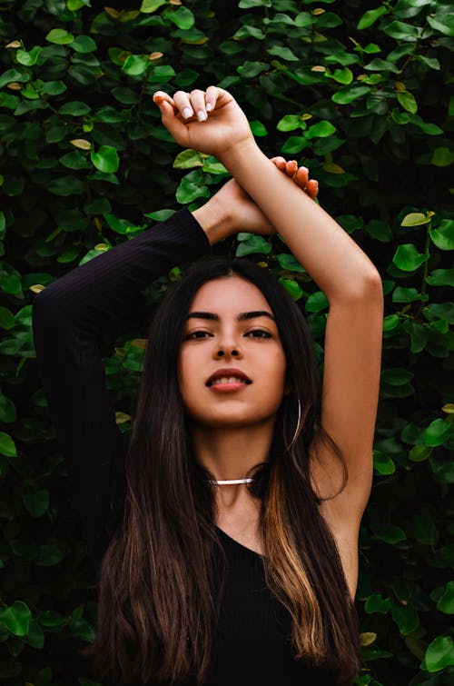 Free A Woman Standing Near the Plants Stock Photo