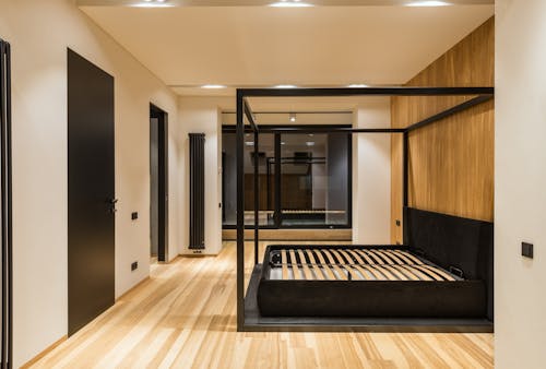 Modern bedroom interior with bed frame at home