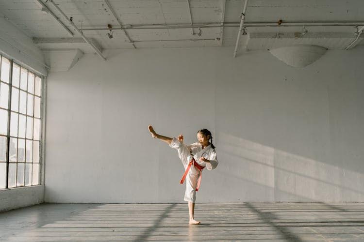 A Girl Practicing Taekwondo