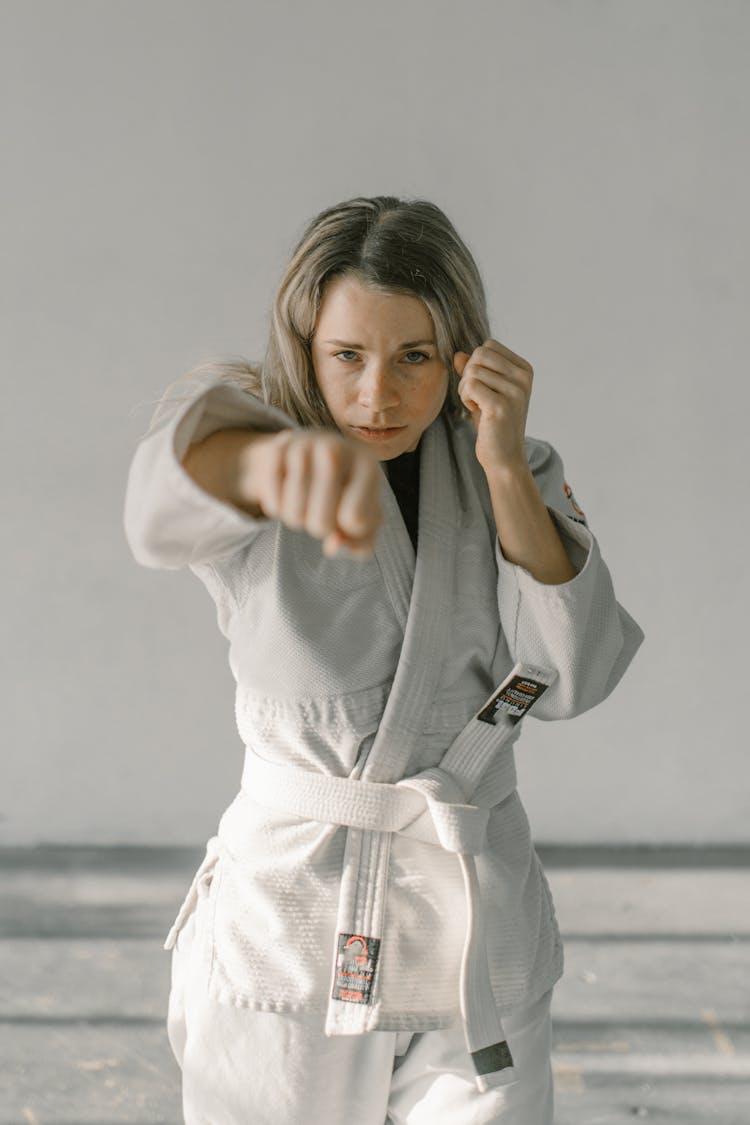 Girl In Judo Uniform With Punching Pose