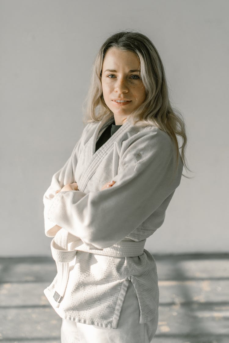 Woman In White Judo Uniform Smiling