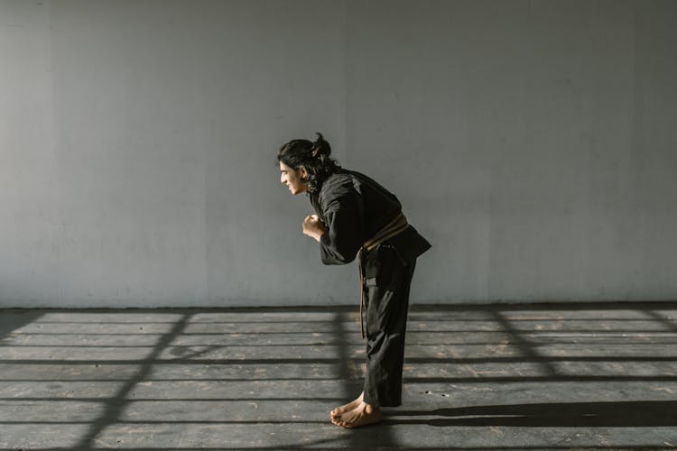 Man Wearing Black Judo Uniform Bowing