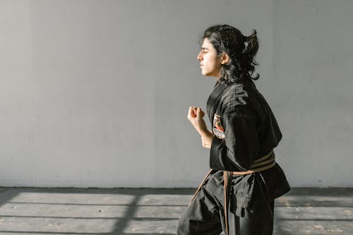 Young Man in Black Karate Uniform