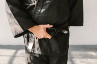 Person in Judo Uniform with Black Belt