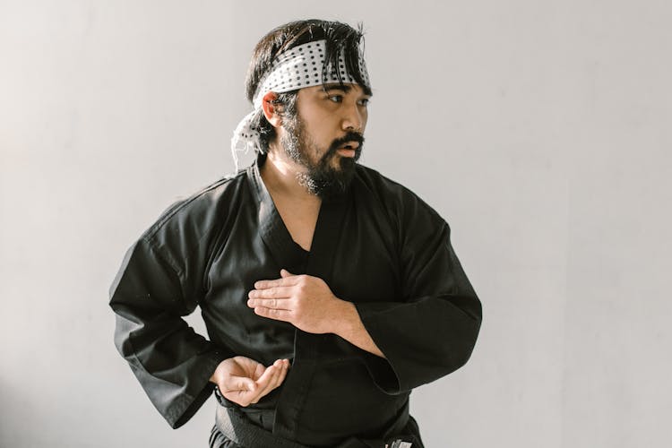 A Man Wearing White And Black Hachimaki 