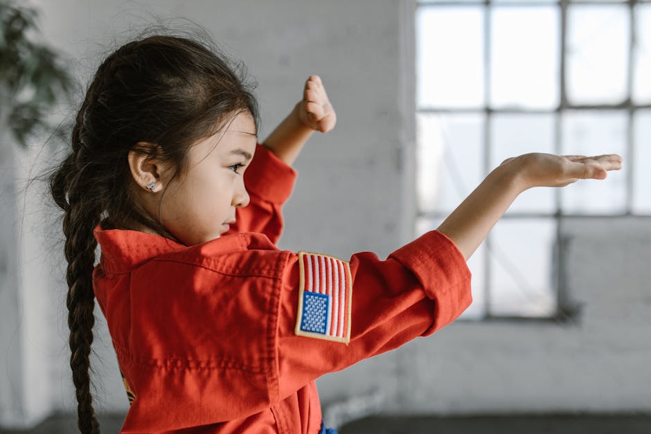 Photo of a Child Wearing Red Dobok