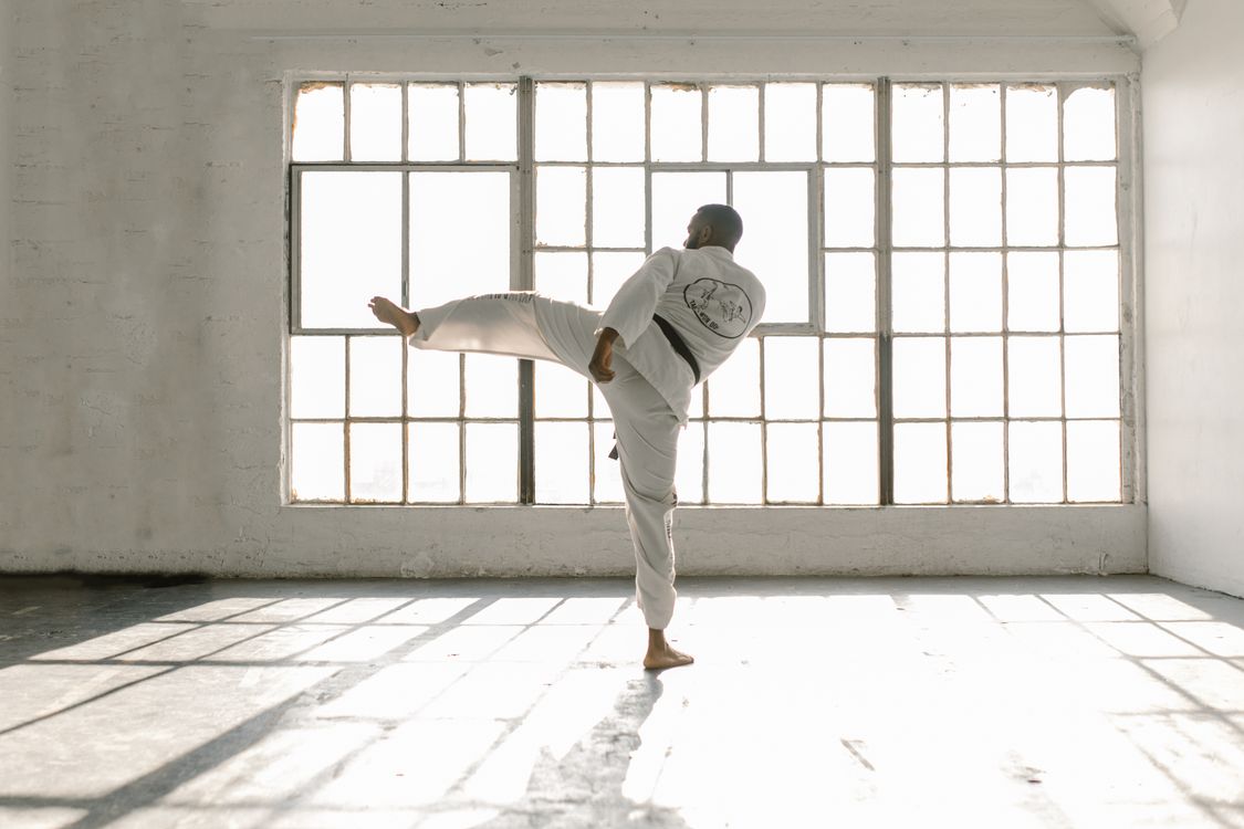 Kick Back View Back View of a Man Doing a Side Kick · Free Stock Photo