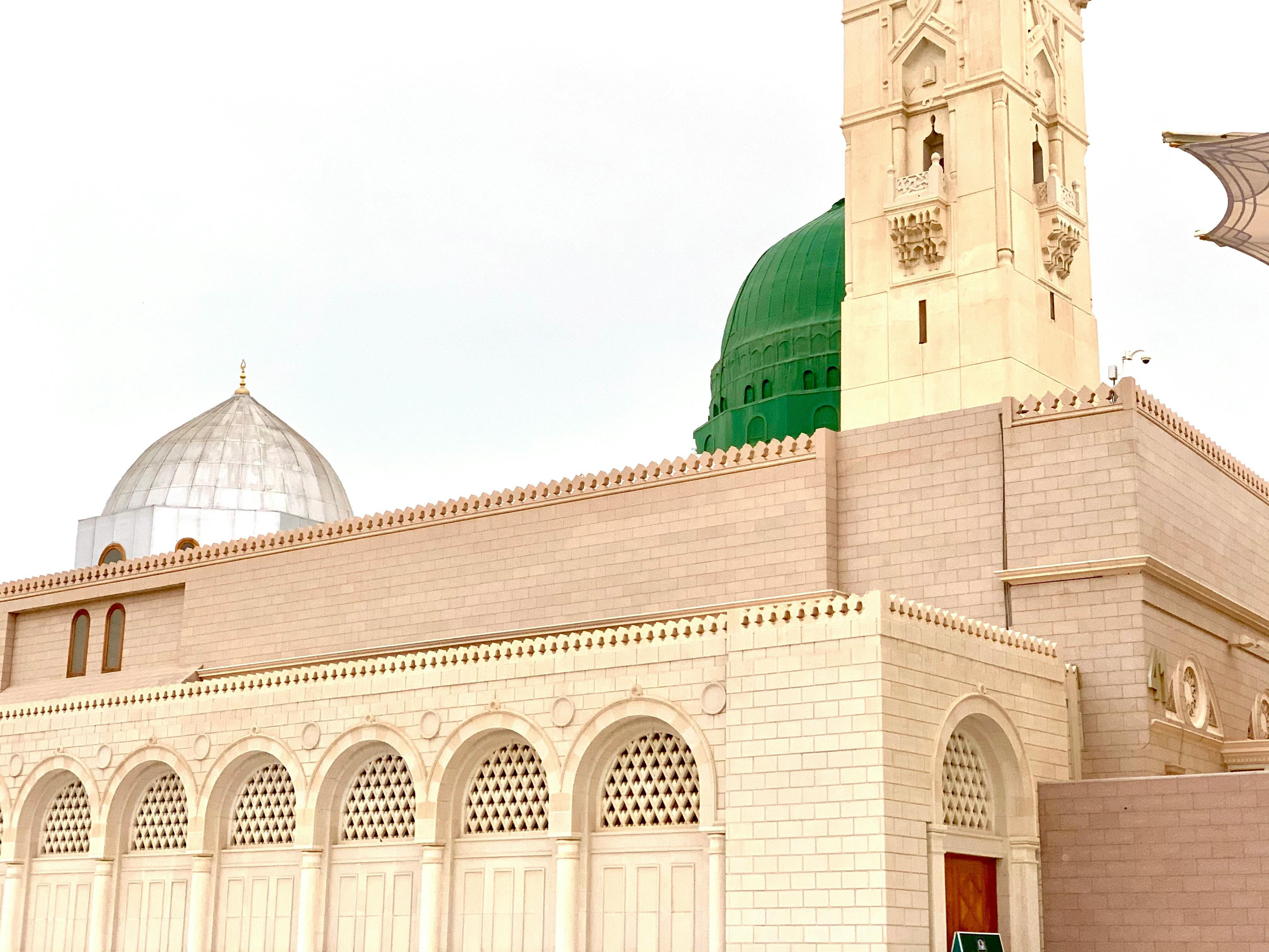 Assorted fermented foods in small bowls such as kimchi, pickles, and sauerkraut on a wooden table