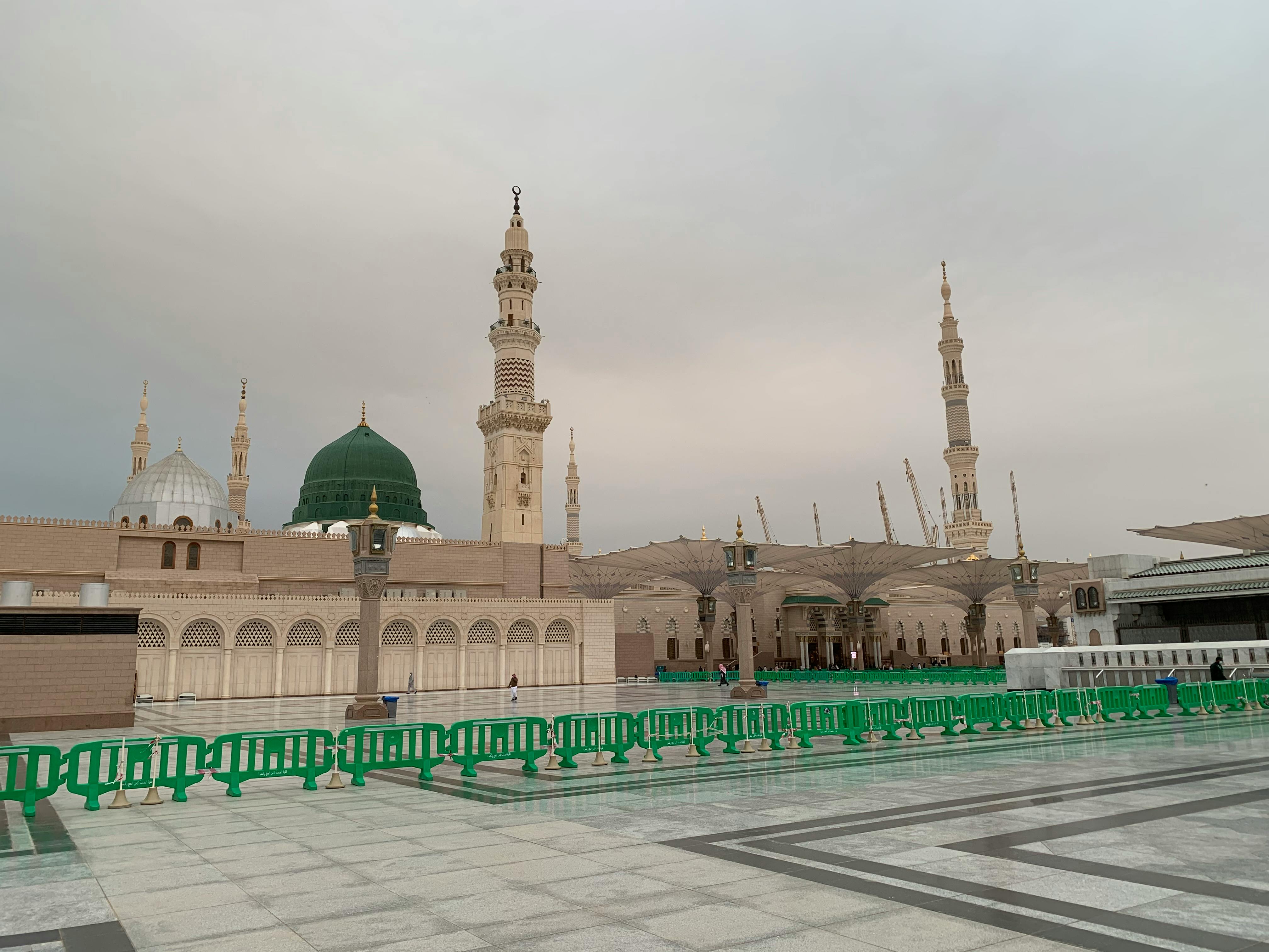 A table set with bowls of stew, bread, and salad for a relaxed shared meal