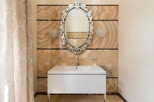 Free Vintage oval shaped mirror in bathroom Stock Photo