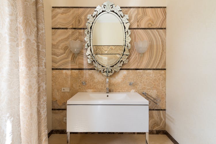 Vintage Oval Shaped Mirror In Bathroom