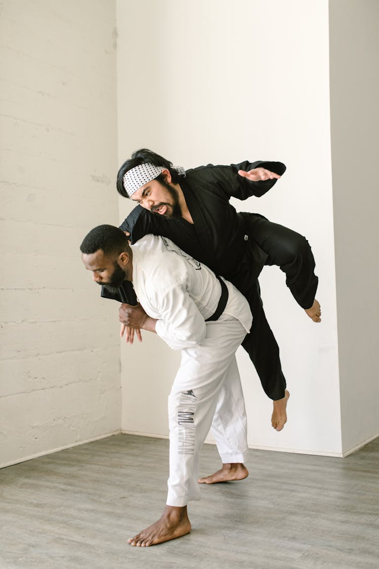 A Pair Of Men In Dobok Training In Martial Arts